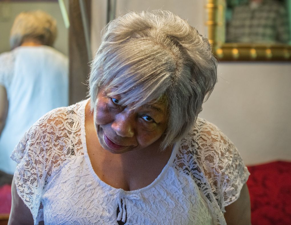 Phyllis Johnson of Bellevue, who has struggled to hold her head up since her 2014 surgery, says she wouldn’t have agreed to the operation if she had known it was double-booked. Records show that for about half her surgery, her doctor was running a second operating room. (Steve Ringman/The Seattle Times)