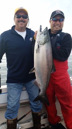 Seattle Times fishing reporter Mark Yuasa with a big king salmon he caught off Westport with Bret Ferris.