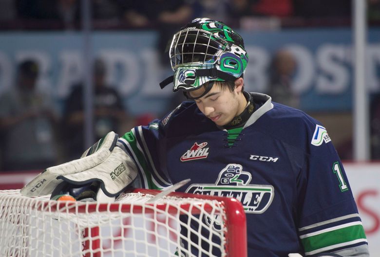 Seattle Thunderbirds goalie Carl Stankowski (1) stands in his crease after allowing three goals on six shots during the first period of a Memorial Cup round robin hockey game against the Windsor Spitfires in Windsor, Ontario, Sunday, May 21, 2017. (Adrian Wyld/The Canadian Press via AP) (Adrian Wyld/AP)
