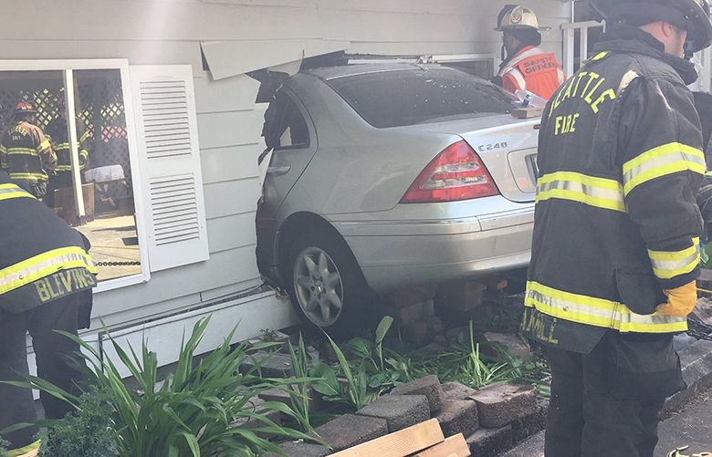 1 dead after car crashes into home in North Seattle | The Seattle Times