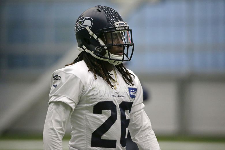 A Seattle Seahawks helmet rests on the field during NFL football