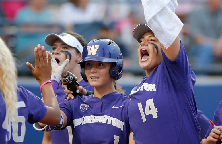 Washington’s Ali Aguilar (1) celebrates with Taran Alvelo (14) after hitting a home run in the sixth inning against UCLA during an NCAA Women’s College World Series softball game in Oklahoma City, Saturday, June 3, 2017. (Bryan Terry/The Oklahoman via AP)