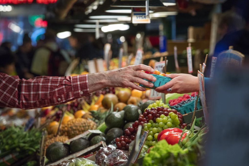 Colorful displays of fresh produce are a big draw at Pike Place Market. (Steve Ringman/The Seattle Times)