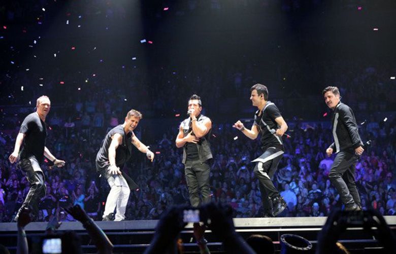 The original lineup of Donnie Wahlberg, Jonathan Knight, Joey McIntyre, Danny Wood and Jordan Knight.with New Kids on the Block (NKOTB) perform at Philips Arena on the Main Event tour on Saturday, June 6, 2015, in Atlanta. (Photo by Robb D. Cohen/Invision/AP)