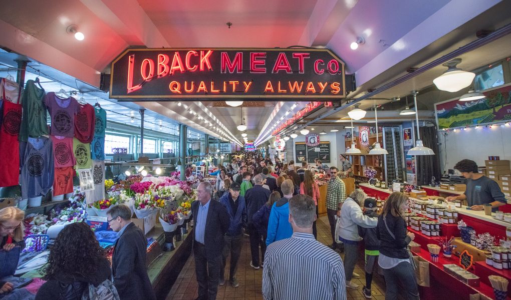 Pike Place Market’s original Loback Meat Co. closed in 1986, but its neon sign lives on, historically protected. (Steve Ringman/The Seattle Times)