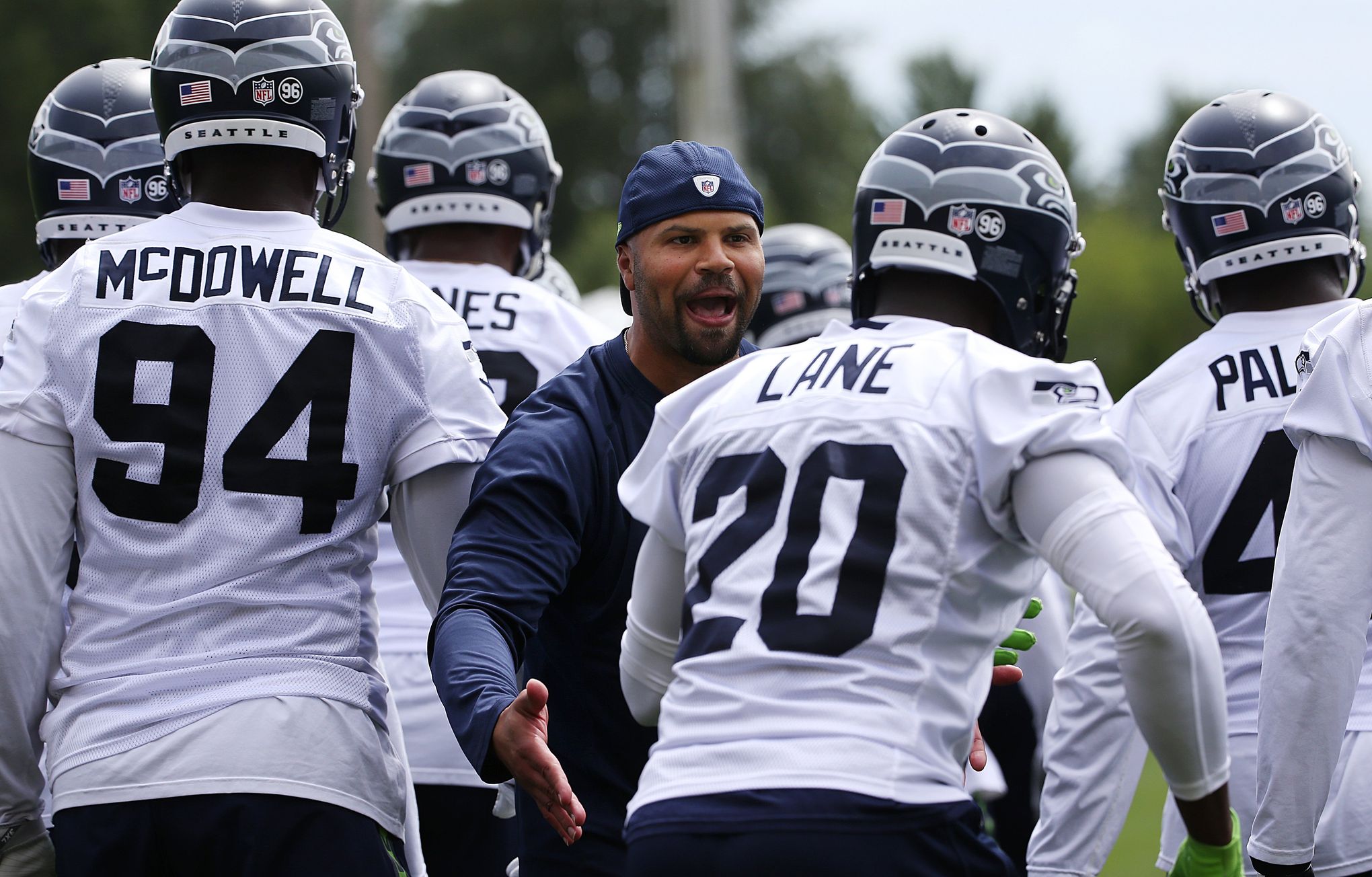 Seahawks defensive coodinator Kris Richard makes a tough phone