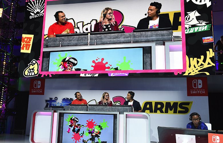 Jordan Kent, from left, Ashley Esqueda and Eric Smith host the 2017 Splatoon 2 World Inkling Invitational tournament at the annual E3 video game convention on Tuesday, June 13, 2017, in Los Angeles.(Jordan Strauss/AP Images for Nintendo)