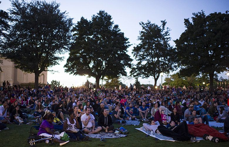080814 – Seattle – Washington – Moviegoers gather in Cal Anderson Park to watch Dirty Dancing as presented by The Three Dollar Bill Outdoor Cinema on August 8, 2014 in Seattle, Washington. The showing was part of the series entitled “Teenage Dreams”, which will also include the movie Clueless and Teen Witch, which will be shown later in the month.
