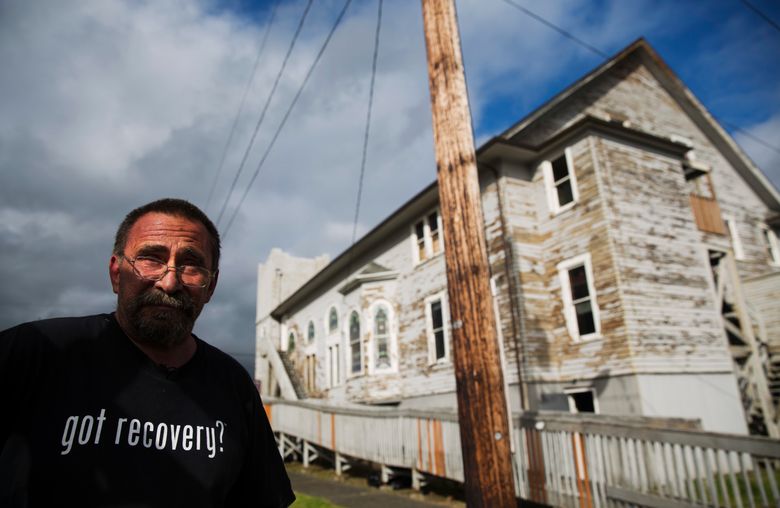 Robert LaCount, a recovering addict, stands outside an old church he is fixing up as a community center in Hoquiam, Wash., Monday, June 12, 2017. For years, LaCount cycled in and out of jail and it did nothing to stop the addiction. He didn’t care if he lived or died; he endangered his own children, spent Christmases in missions, until one day it occurred to him that his life had been so empty no one would care enough to claim his body from the morgue when he died. He got clean nine years ago, and now runs a sober housing program where he fields 10 calls a day that he has to say no to because there’s so much need and so few resources. (AP Photo/David Goldman)