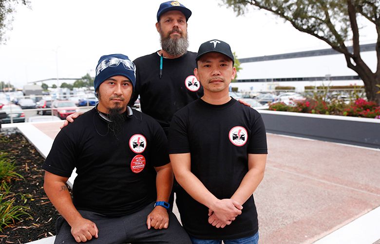 Tesla workers Mikey Catura, Branton Phillips and Hai Nguyen, left to right, are photographed at the Tesla factory in Fremont, Calif., on Friday, Aug. 11, 2017. The trio have voiced their concerns on workplace safety and wages as Tesla ramps up production to deliver its new Model 3 later this year. (Gary Reyes/ Bay Area News Group/TNS)  1208750 1208750
