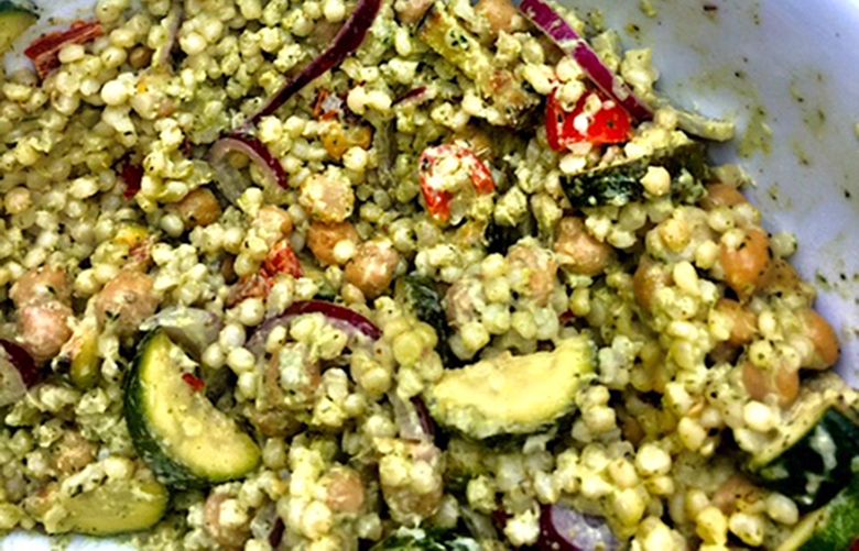 The larger grains of Israeli couscous combine with chickpeas, grilled vegetables and vibrant Green Goddess dressing come together in an excellent salad for late summer. (Kathleen Purvis/Charlotte Observer/TNS)