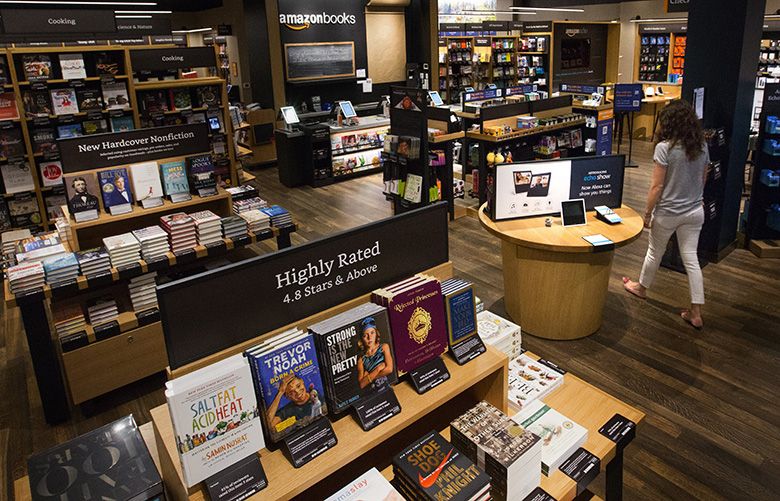 An Amazon employee walks through the new Amazon bookstore in Bellevue Square Tuesday, August 22, 2017.  The store will open in the fall of 2017.