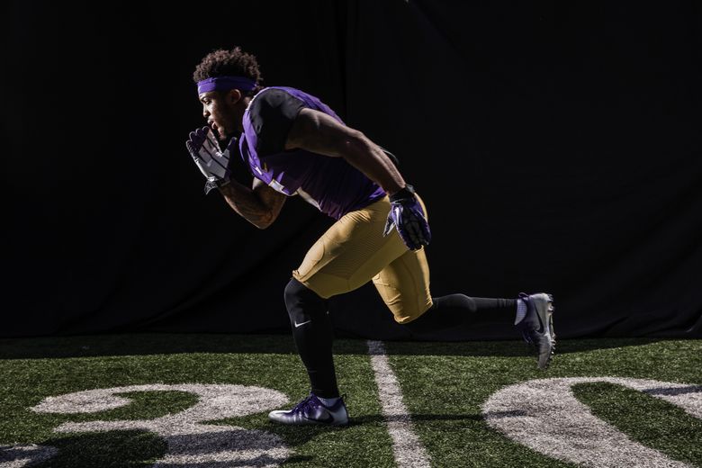It’s all about physics when WR Chico McClatcher and other Huskies try to add speed. A tracking system monitors force going into and back out of the ground when running. (Dean Rutz/The Seattle Times)