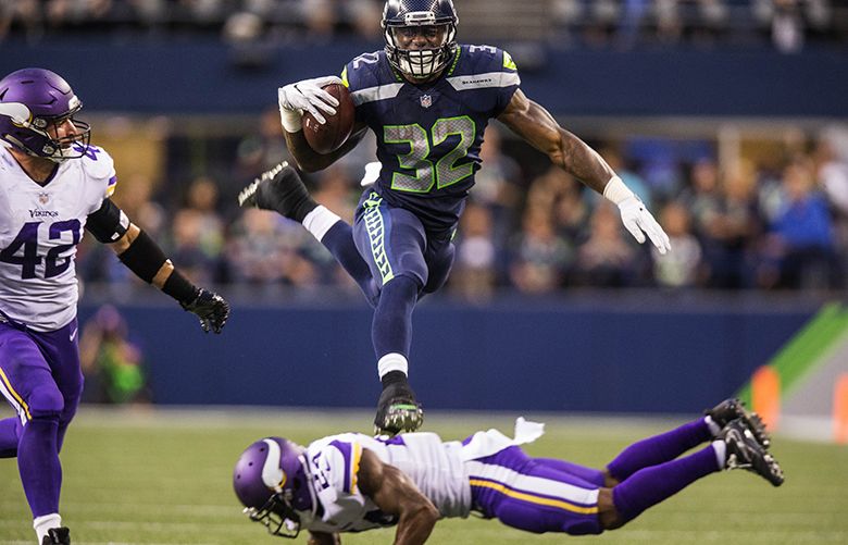 Seattle Seahawks running back Chris Carson (32) rushes at Cleveland Browns  defensive back T.J. Carrie (38) during an NFL football game in Cleveland,  Sunday, Oct. 13, 2019,(AP Photo/Rick Osentoski Stock Photo - Alamy