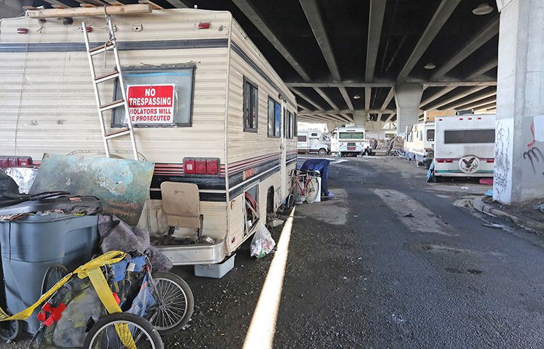 On Thursday, April 5, 2017, under the Spokane Street Bridge, trailers and some motor homes are parked for several blocks.