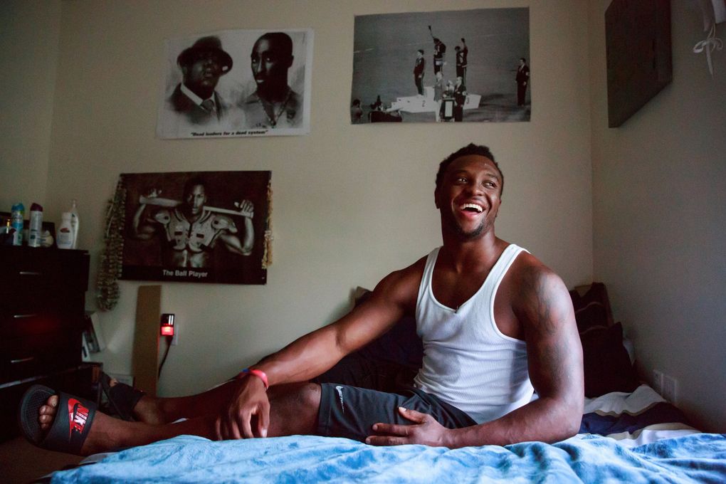 WSU running back Jamal Morrow shows of his room at his apartment in Pullman, Wash. Wednesday July 5, 2017. Morrow’s room is decorated in posters of music artists the Notorious B.I.G. and Tupac Shakur, as well as famous athletes, high school jerseys and family photos. (Erika Schultz / The Seattle Times)