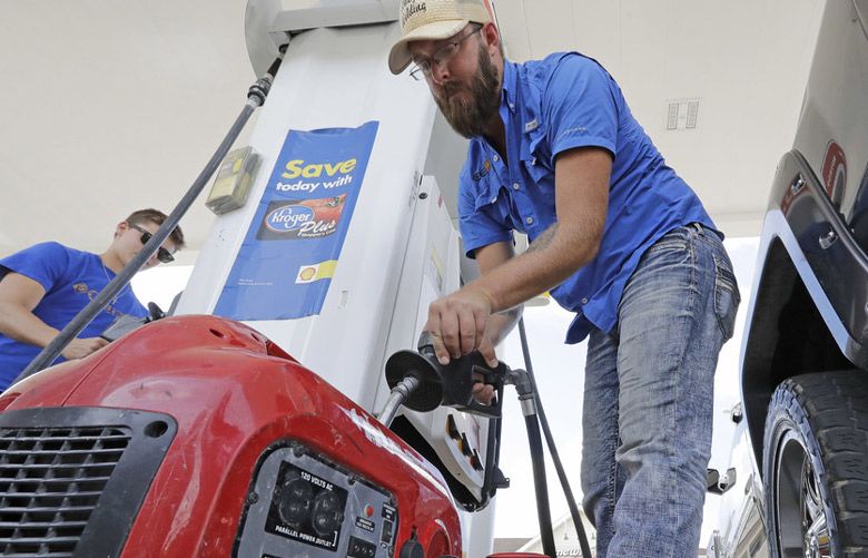 Inflation cooled last month as gas prices fell, though costs remain elevated