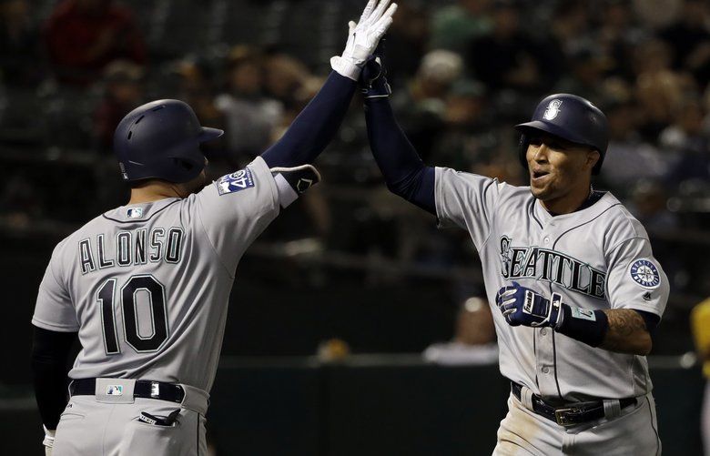 Mariners rally to beat A’s 76 in extra innings, tied for second wild
