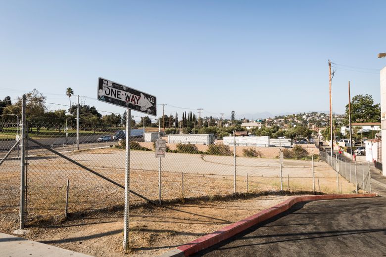 An empty lot in Los Angeles is a reminder that money isn’t the only obstacle to solving homelessness. After strong opposition from the neighborhood, a City Council committee has blocked a homeless housing complex proposed for the site.  (EMILY BERL/NYT)