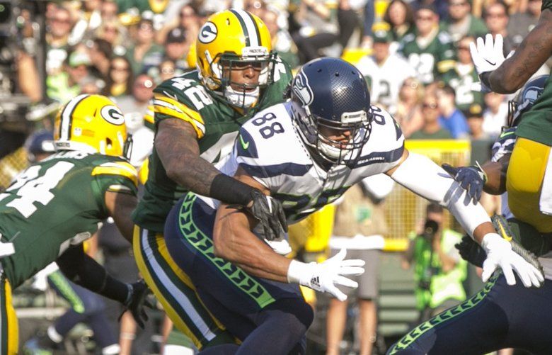 Seattle Seahawks tight end Jimmy Graham (88) brushes off a tackle by  Carolina Panthers outside linebacker A.J. Klein (56) at CenturyLink Field  in Seattle, Washington on December 4, 2016. Graham caught six