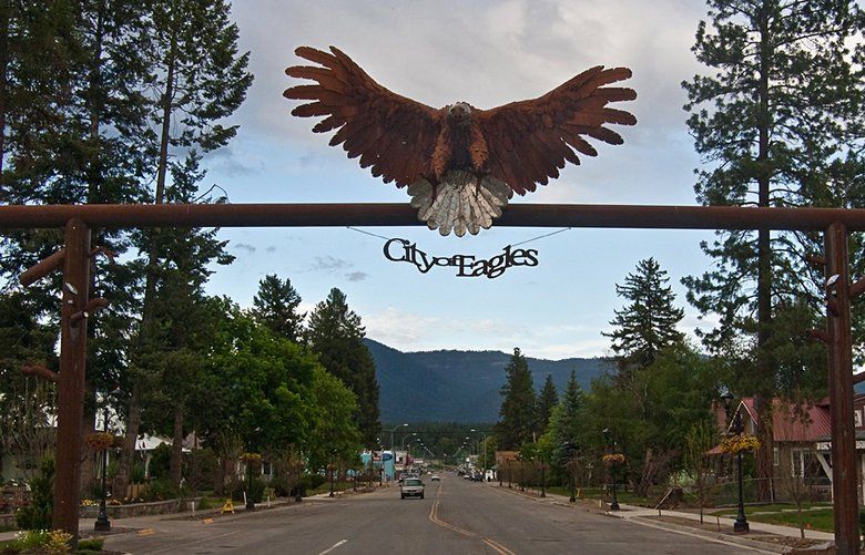FILE – In this June 17, 2009 file photo, an eagle sign welcomes visitors at the entrance to downtown Libby, Mont.  Asbestos-plagued Libby, Mont., has reached a significant milestone in its decade-long cleanup as the federal government completes the makeover of a former vermiculite processing plant into a town park. Following a 12-year cleanup, officials say a wedding in the newly-constructed Riverfront Park is lined up for the summer and a blues festival is scheduled for early August. It’s a dose of normalcy that marks a major milestone for Libby, a mining town of about 3,000 people near the Canadian border that has become synonymous with lung disease and death after an estimated 400 people to date have been killed by asbestos exposure.  (AP Photo/Rick Sheremeta, File) MTMB204