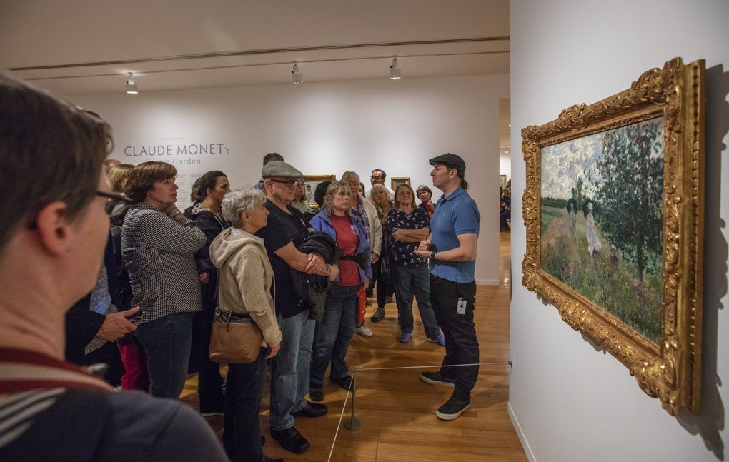 A tour group visits a Claude Monet exhibition at Vancouver Art Gallery. Vancouver has a lively arts scene Seattleites don’t always hear about. (Steve Ringman/The Seattle Times)
