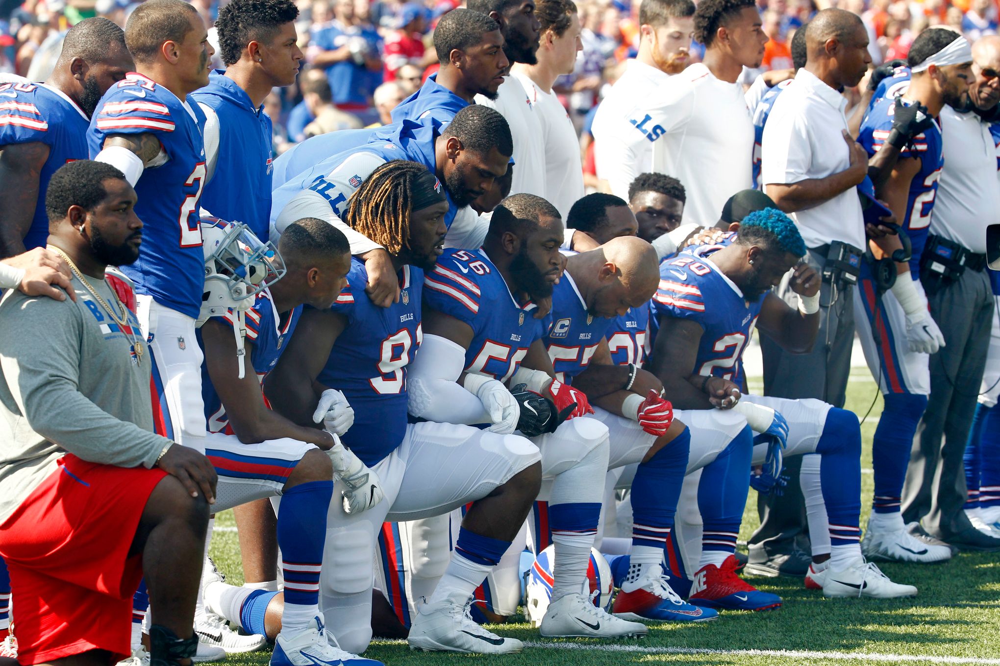 More than 200 NFL players sit or kneel during anthem