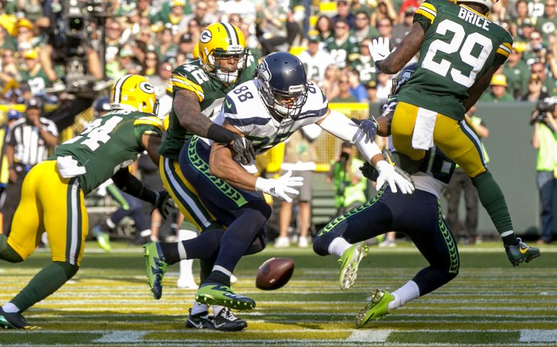 Seattle Seahawks tight end Jimmy Graham (88) brushes off a tackle by  Carolina Panthers outside linebacker A.J. Klein (56) at CenturyLink Field  in Seattle, Washington on December 4, 2016. Graham caught six