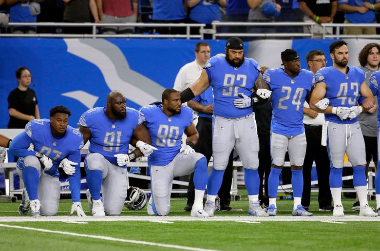 More than 200 NFL players sit or kneel during anthem