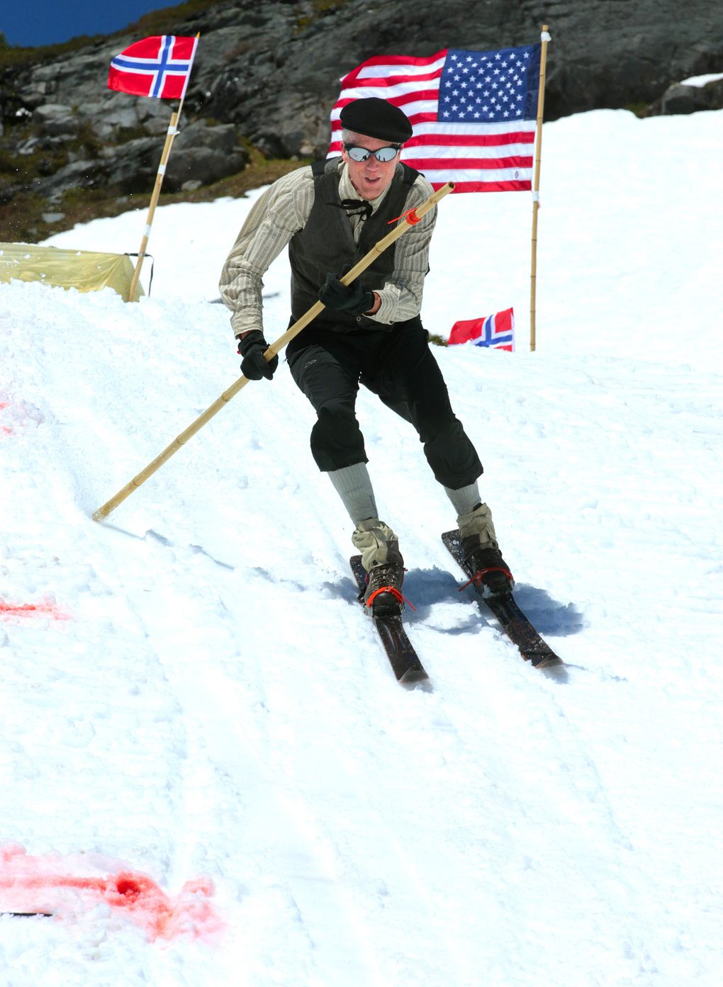 Lowell Skoog, a ski historian, recreates a ski-jumping event at Mount Rainier National Park. Flags from Norway and the United States were placed at the jump. (Mike Siegel/The Seattle Times)