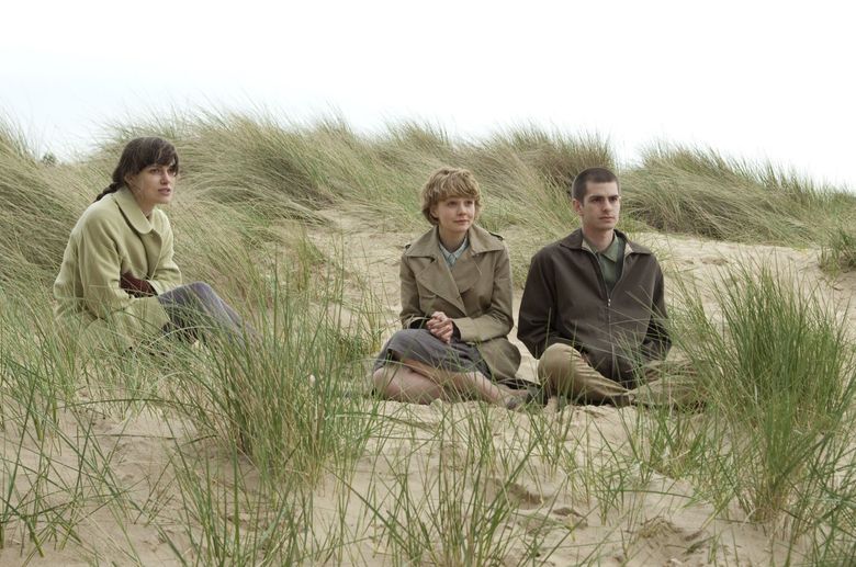 Keira Knightley, left, Carey Mulligan and Andrew Garfield in the big-screen adaptation of Kazuo Ishiguro’s novel “Never Let Me Go.” (Alex Bailey / Fox Searchlight)