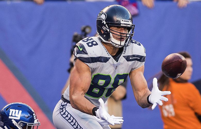 Seattle Seahawks tight end Jimmy Graham (88) brushes off a tackle by  Carolina Panthers outside linebacker A.J. Klein (56) at CenturyLink Field  in Seattle, Washington on December 4, 2016. Graham caught six