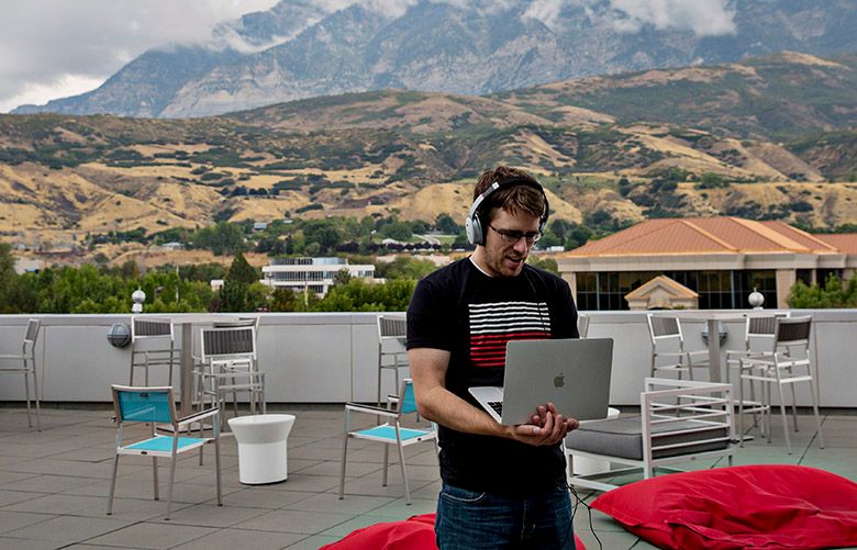Lance Winward, an engineer at Qualtrics, a data analytics company, has a phone conference on the companyâ€™s patio in Provo, Utah, Sept. 15, 2017. Utah has a thriving technology hub dubbed â€œSilicon Slopesâ€ in the roughly 80-mile swath dubbed from Provo to Ogden, with Salt Lake City in between. (Kim Raff/The New York Times)