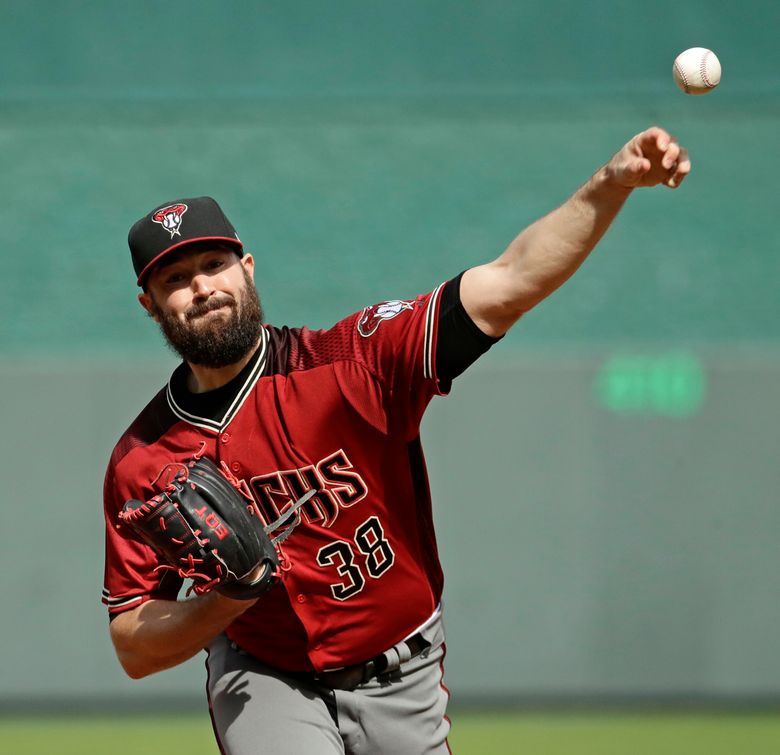 Arizona Diamondbacks starting pitcher Robbie Ray (38) throws