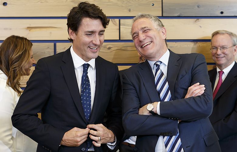 Justin Trudeau, Canada’s prime minister, left, laughs with Dan Doctoroff, chief executive officer of Sidewalk Labs LLC, during an event in Toronto, Ontario, Canada, on Tuesday, Oct. 17, 2017. Sidewalk Labs LLC, the urban innovation unit of Alphabet Inc., and Waterfront Toronto plan to foster the development of a high-tech community from scratch along Lake Ontario in Canada’s biggest city. The area aims to become an innovation hub for technologies that improve city life, from green energy systems, to self-driving transit and new construction techniques that can lower housing costs, the companies said in a a statement. Photographer: Cole Burston/Bloomberg