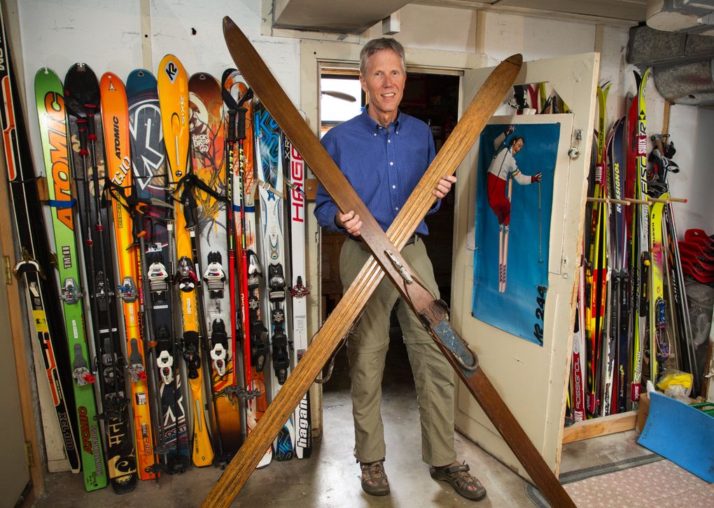 In this file photo, Lowell Skoog holds a pair of hickory Nordic jumping skis with cable bindings once owned by the late Wolf Bauer. (Mike Siegel / The Seattle Times)