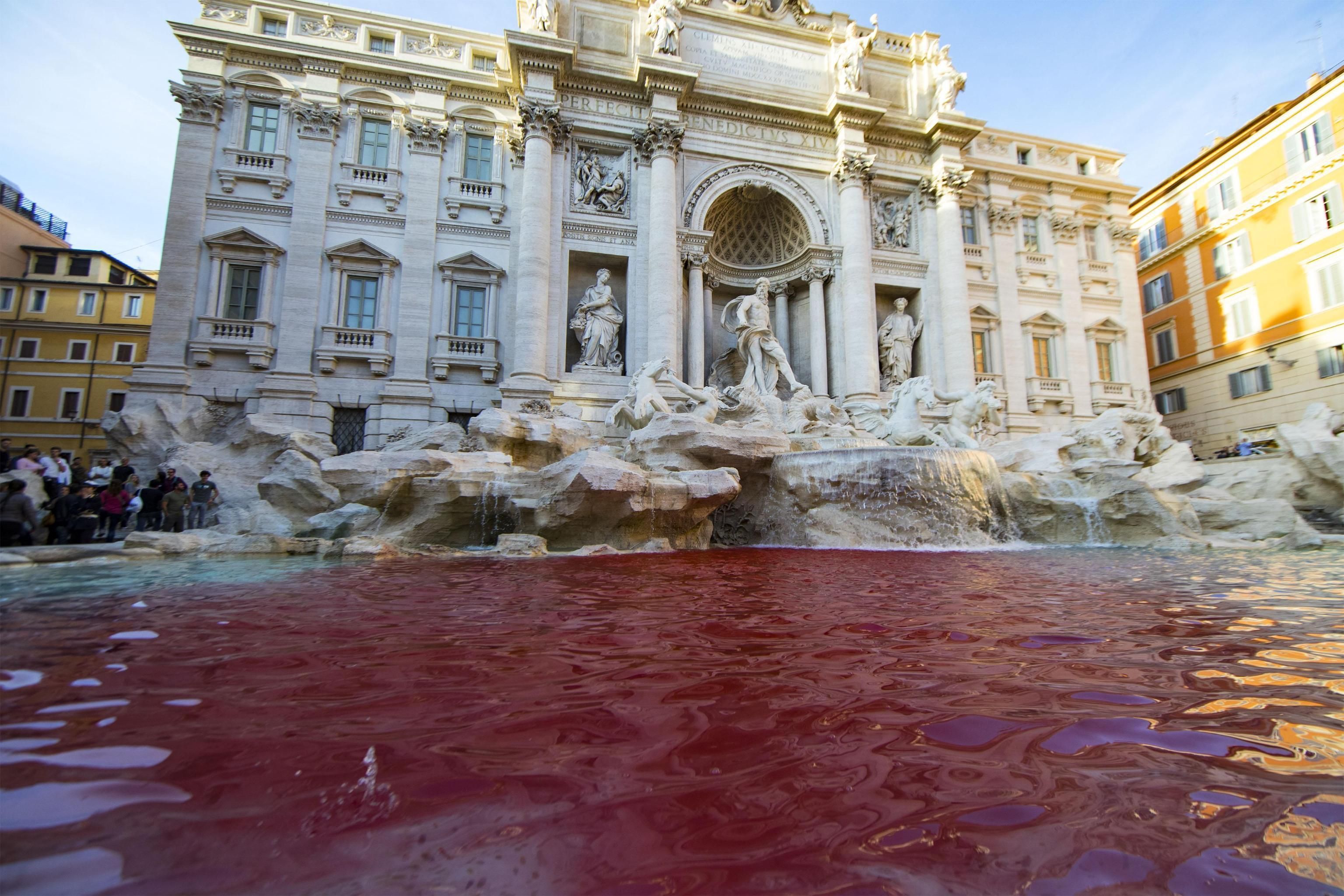 Activist-vandal dyes water of Rome's Trevi Fountain red | The