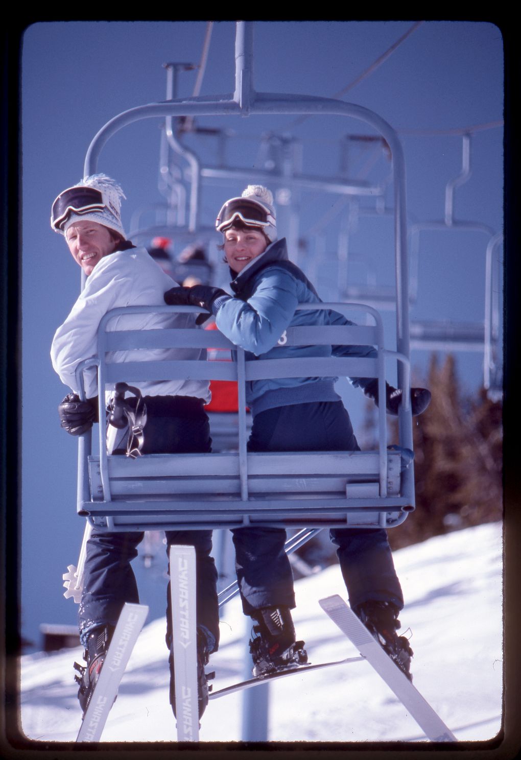 Lowell Skoog and Stephanie Subak sit on the Green Valley chairlift at Crystal Mountain Ski Area. (Photo by Carl Skoog)