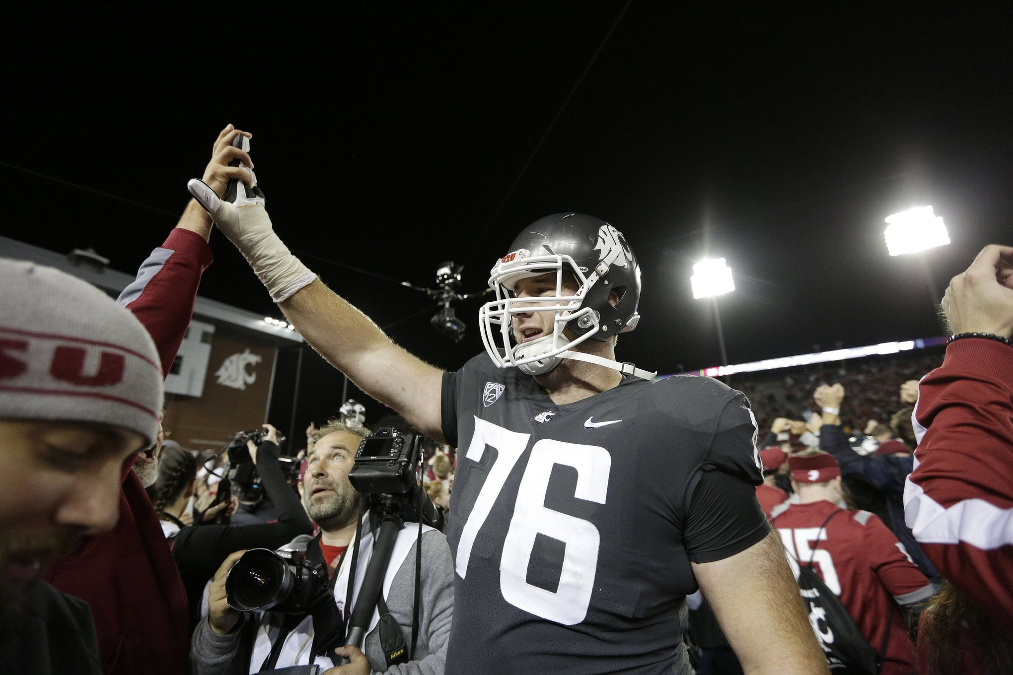 Former Washington State football players Frankie Luvu, River