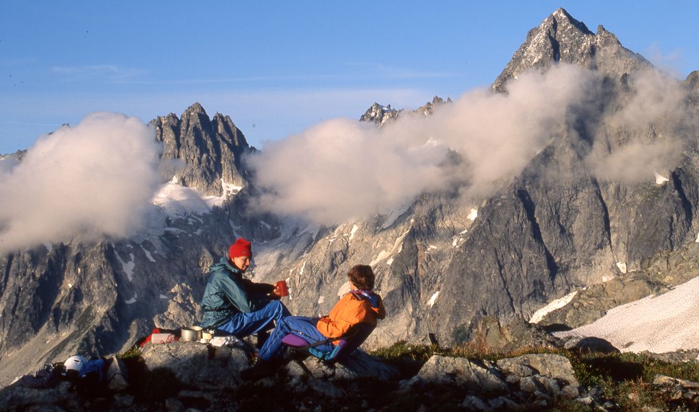Lowell Skoog and Stephanie Subak relax at The Triad divide during a trip in the North Cascades. (Photo by Carl Skoog)
