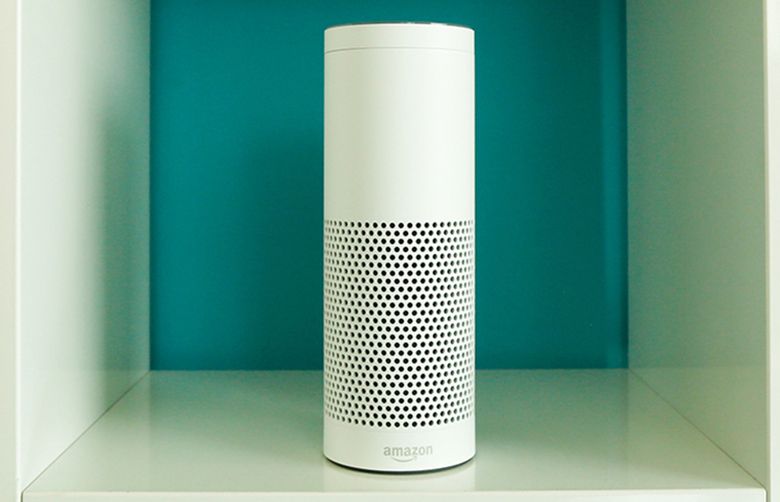 An “Echo” device, center, stands on display in a set of shelves during the U.K. launch event for the Amazon.com Inc. Echo voice-controlled home assistant speaker in London, U.K., on Wednesday, Sept. 14, 2016. The Seattle-based company today announced that its Echo product line will be available in the U.K. and Germany starting in the fall, the first time the gadget will be available outside the U.S. Photographer: Luke MacGregor/Bloomberg