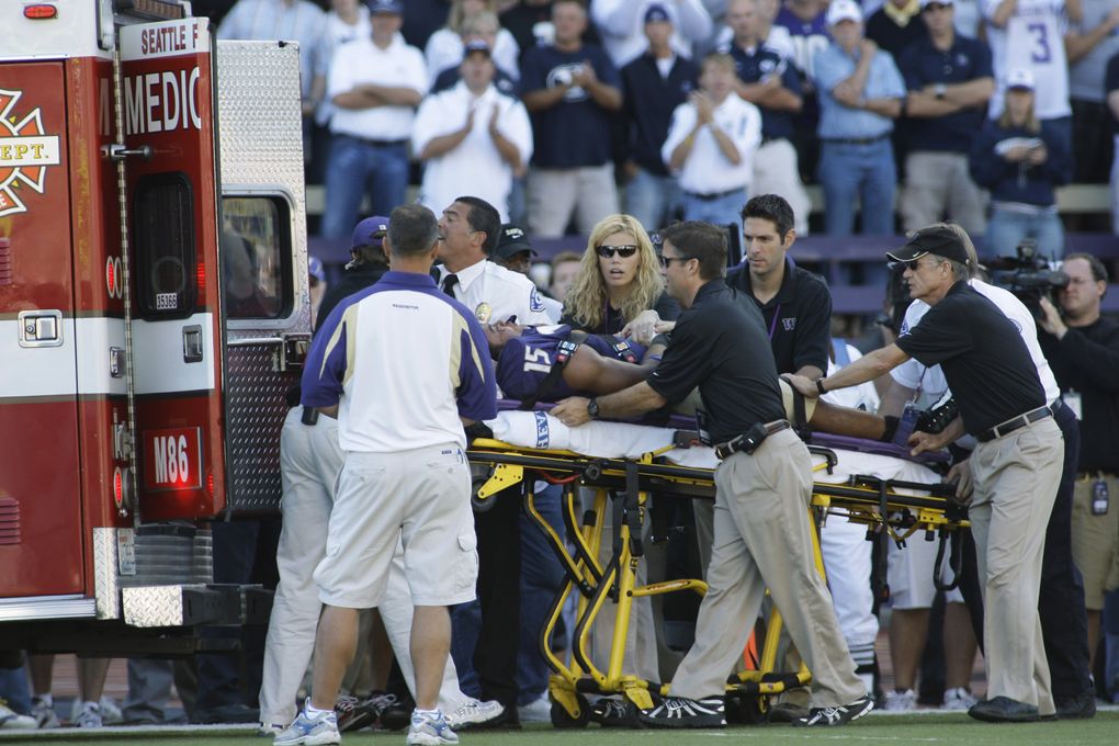 Washington free safety Darin Harris is loaded into an ambulance after his injury. (Ted S. Warren/Associated Press)