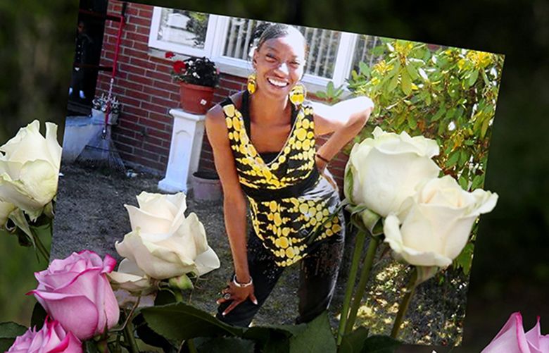 People attend a memorial outside the apartment building of Charleena Lyles, displayed in several photos, who was killed by Seattle Police, Sunday, June 18, 2017, in Seattle’s Magnuson Park. 202505