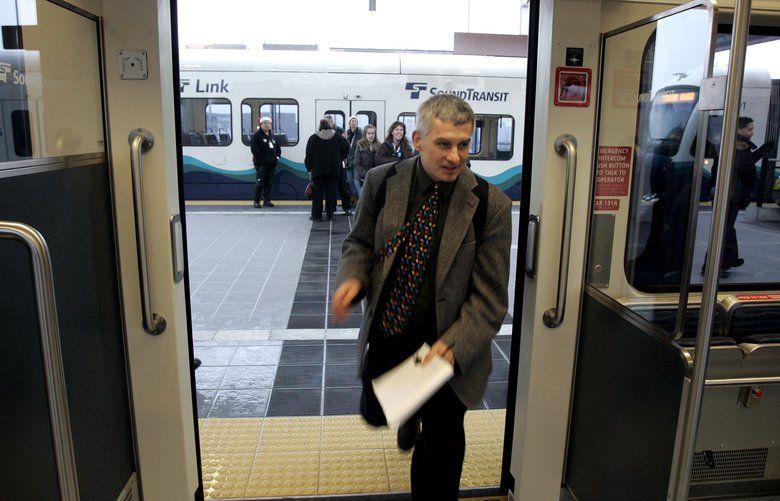 LINK LIGHT RAIL LAST LINK
121909  Seattle Times reporter Mike Lindblom, who coveres transit issues and Link Light Rail, make the train on Saturday morning when the route finally opens from downtown Seattle to the airport.