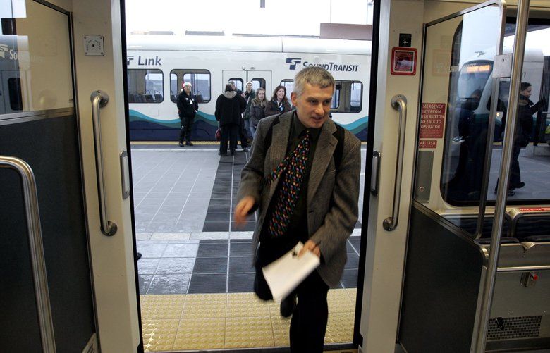 LINK LIGHT RAIL LAST LINK
121909 Seattle Times reporter Mike Lindblom, who coveres transit issues and Link Light Rail, make the train on Saturday morning when the route finally opens from downtown Seattle to the airport.