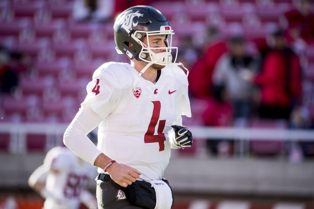 Quarterback Luke Falk and the Washington State University Cougars warm up to take on the University of Utah Utes at Rice-Eccles Stadium in Salt Lake City Saturday.(Bettina Hansen / The Seattle Times)