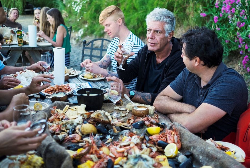 Anthony Bourdain chows down at a clam bake on Vashon Island during the filming of his CNN series “Parts Unknown,” that aired on Nov. 19. (Courtesy of CNN)