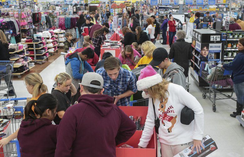Shoppers at Walmart take advantage of Black Friday deals in Idaho Falls, Idaho on Friday, Nov. 24, 2017. (John Roark/The Idaho Post-Register via AP) IDIDF303 IDIDF303