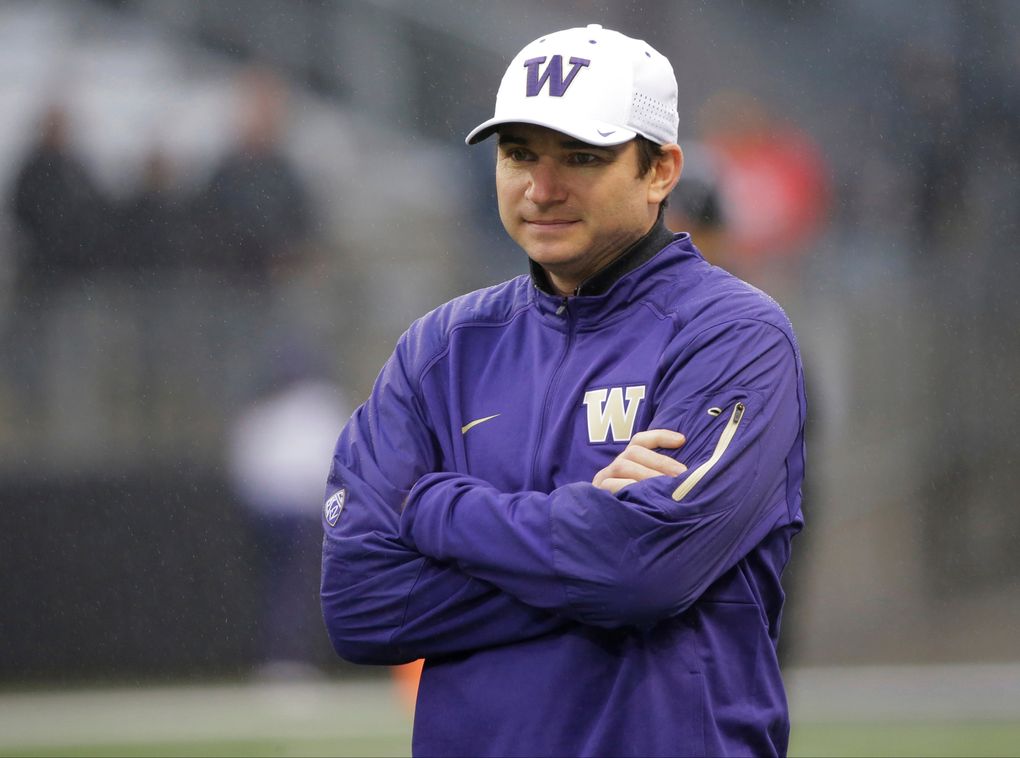 In this Saturday, Nov. 7, 2015 file photo, Washington offensive coordinator and quarterbacks coach Jonathan Smith looks on during warmups before an NCAA college football game against Utah in Seattle.(AP Photo/Ted S. Warren, File)