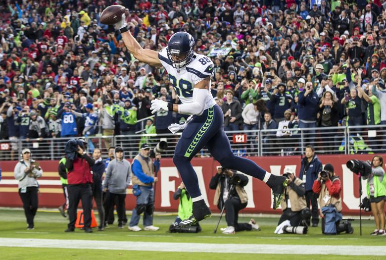 Seattle Seahawks tight end (88) Jimmy Graham gains yards after a